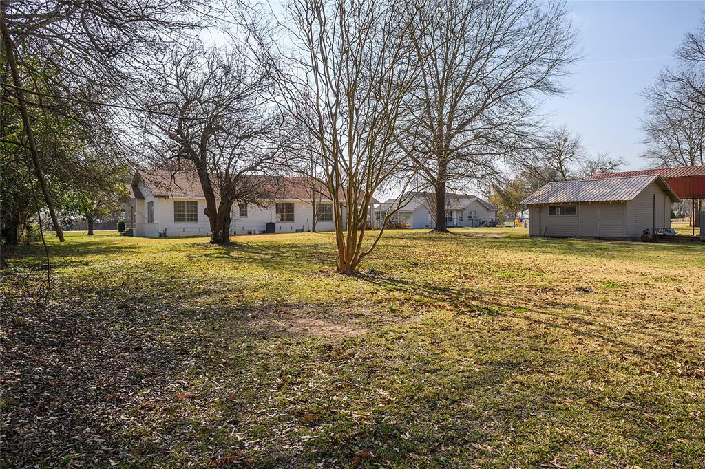13040 Adger Road Gilliam, LA 71029 - Photo 23 of 29 a view of a yard with a large tree