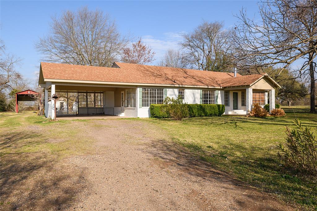 13040 Adger Road Gilliam, LA 71029 - Photo 26 of 29 a front view of a house with a yard and lake view