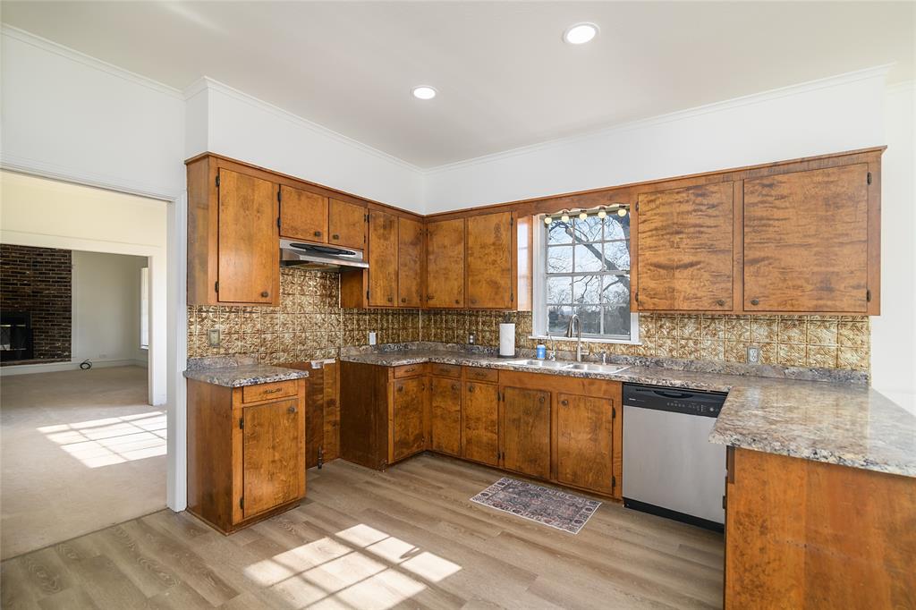 13040 Adger Road Gilliam, LA 71029 - Photo 10 of 29 a kitchen with stainless steel appliances granite countertop a stove a sink and a microwave