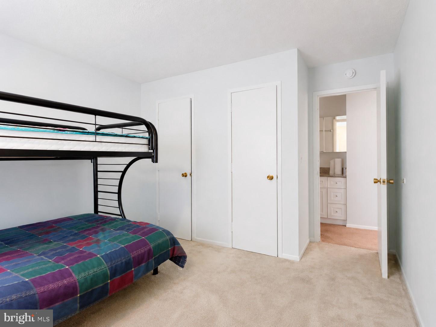 1724 Mosser Road, Unit 11 McHenry, MD 21541 - Photo 17 of 24 a bedroom with a bed and a chandelier