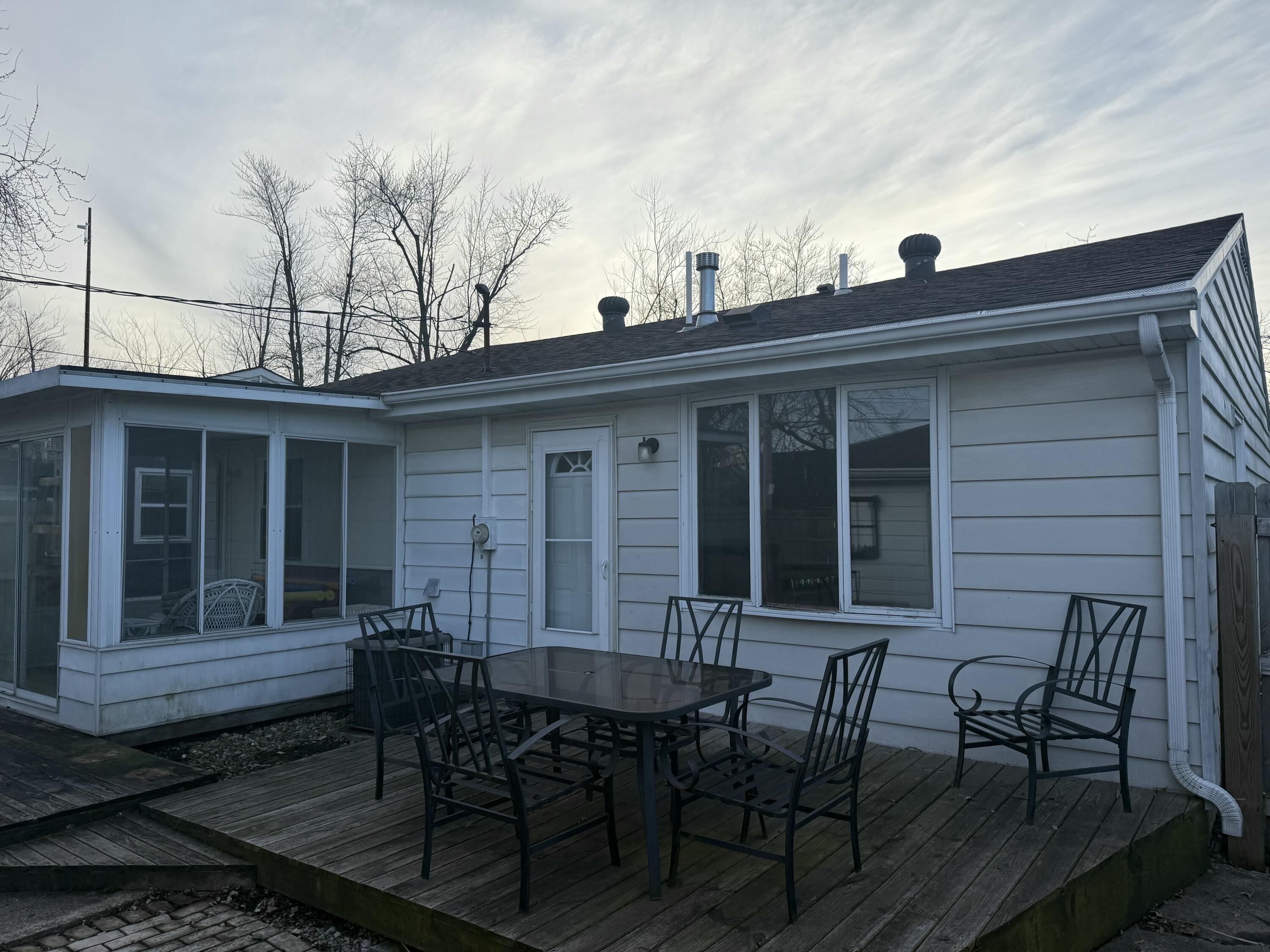 733-1 Imperial Road Valparaiso, IN 46385 - Photo 11 of 16 a view of a house with chairs and table in a patio