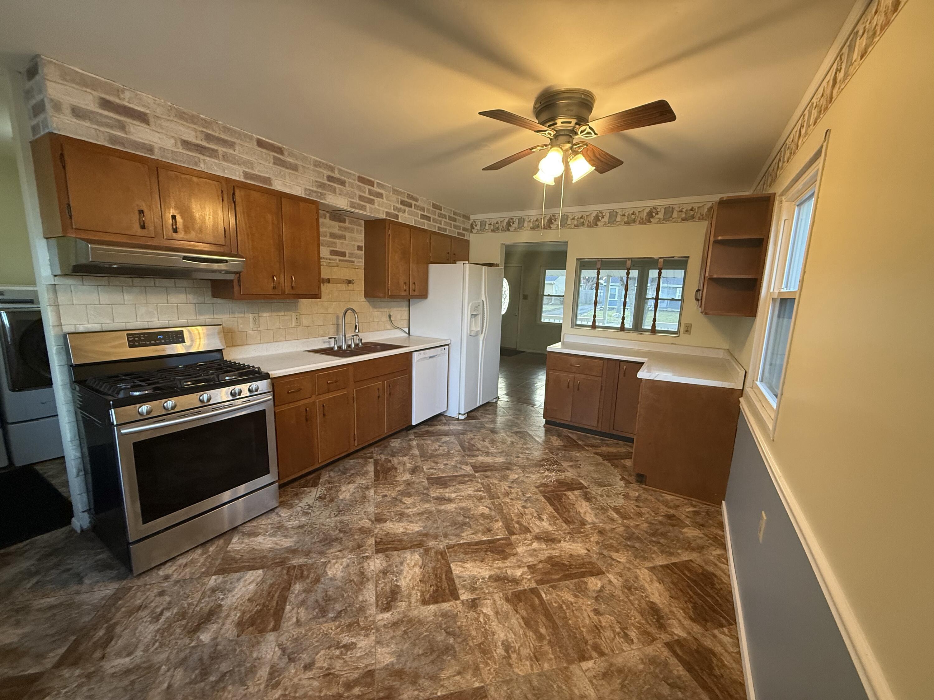 733-1 Imperial Road Valparaiso, IN 46385 - Photo 3 of 16 a kitchen with stainless steel appliances granite countertop a sink stove and refrigerator