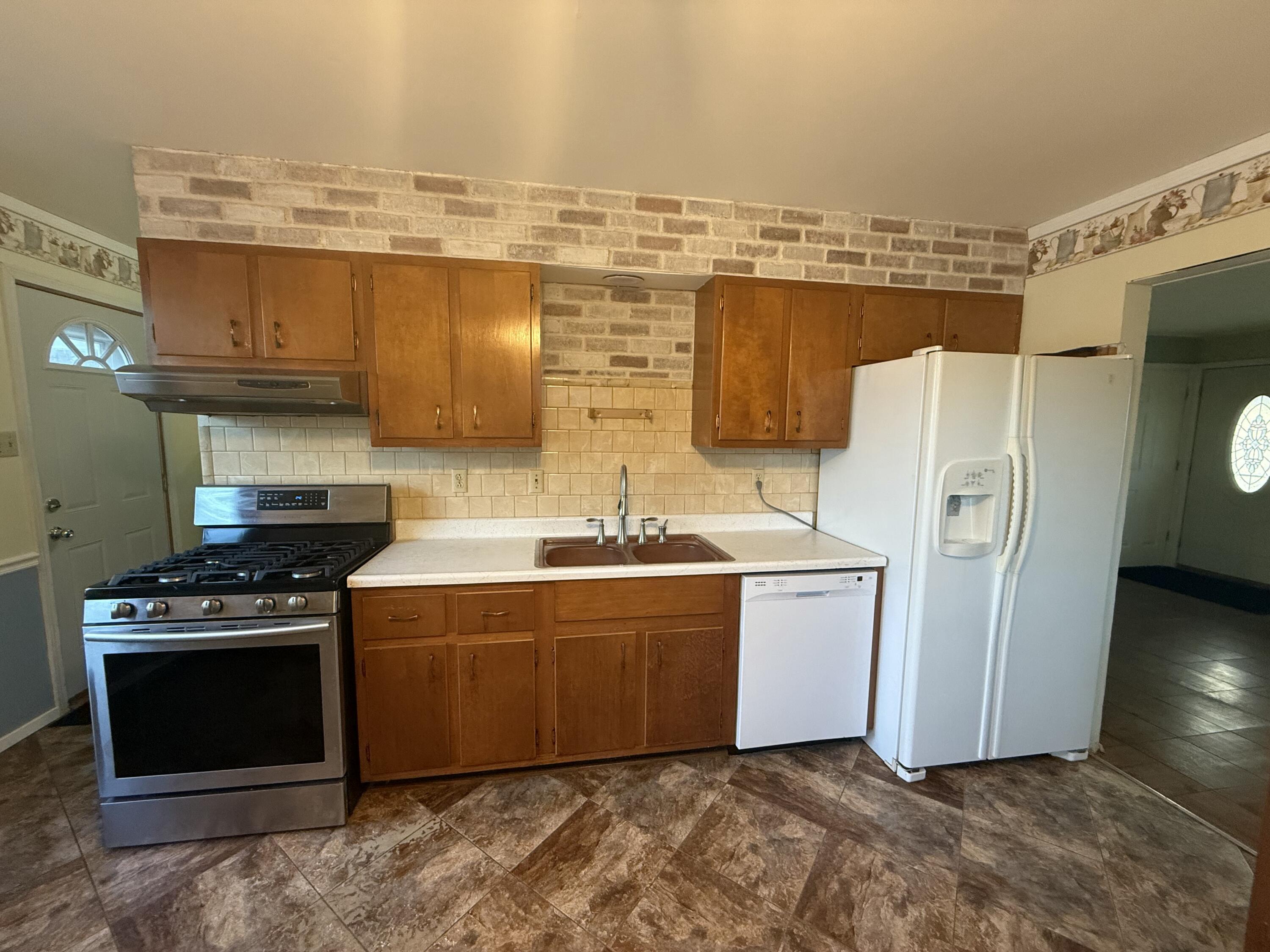 733-1 Imperial Road Valparaiso, IN 46385 - Photo 4 of 16 a kitchen with stainless steel appliances granite countertop a stove and a refrigerator