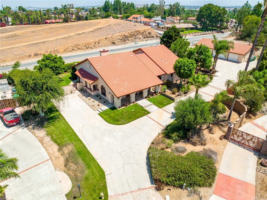 16340 James Court Riverside, CA 92504 - Photo 1 of 1 an aerial view of a house with a yard and lake view