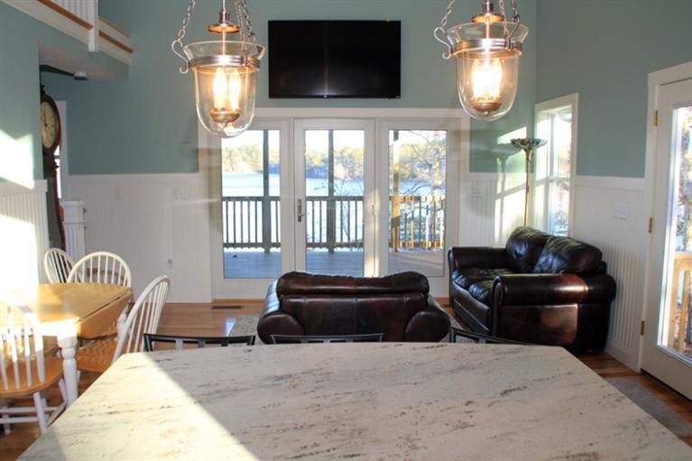173 Sandy Beach Road Plymouth, MA 02360 - Photo 12 of 35 a living room with furniture and a flat screen tv