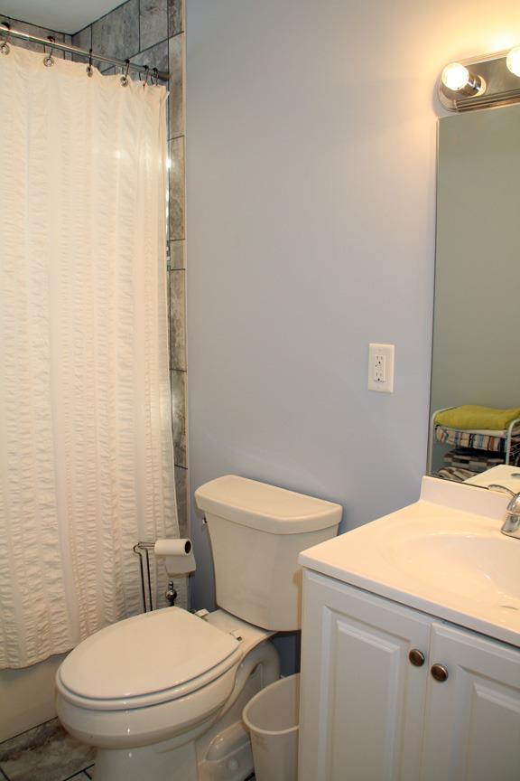 173 Sandy Beach Road Plymouth, MA 02360 - Photo 14 of 35 a white toilet sitting next to a bathroom sink