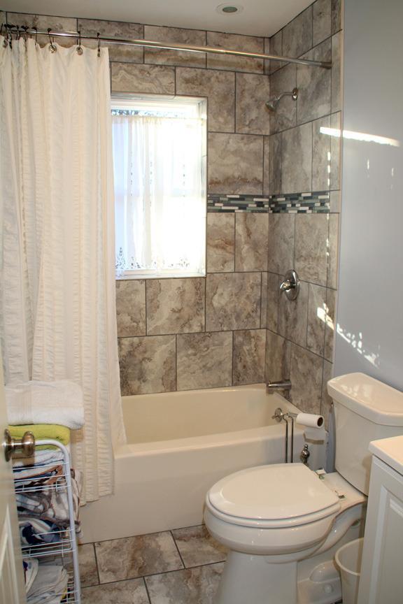 173 Sandy Beach Road Plymouth, MA 02360 - Photo 15 of 35 a bathroom with a toilet a sink and a bathtub