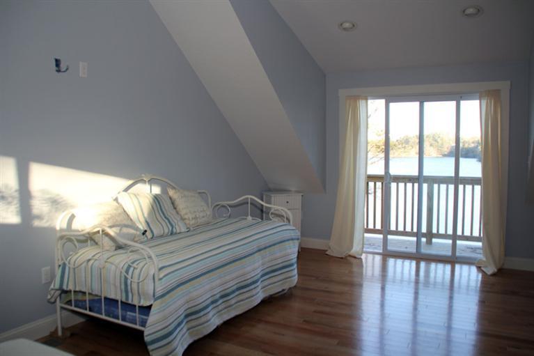 173 Sandy Beach Road Plymouth, MA 02360 - Photo 23 of 35 a bedroom with a bed and a large window