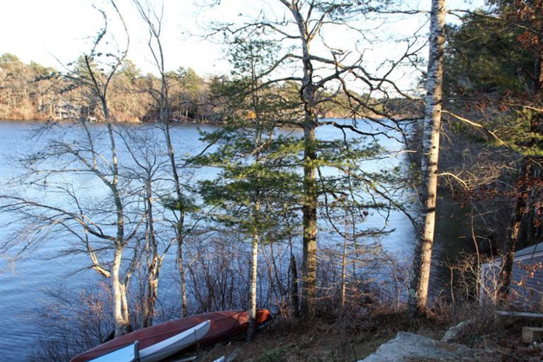 173 Sandy Beach Road Plymouth, MA 02360 - Photo 26 of 35 a backyard of a house with lots of green space