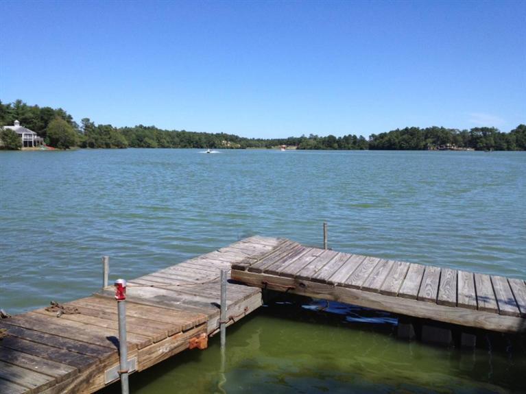 173 Sandy Beach Road Plymouth, MA 02360 - Photo 31 of 35 a view of a lake with houses in the background