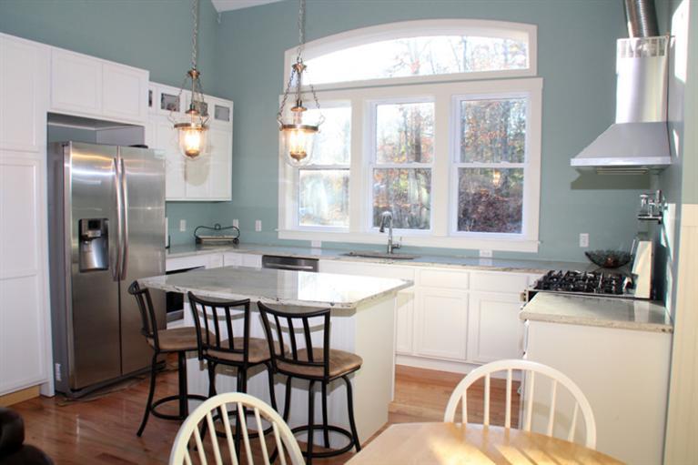 173 Sandy Beach Road Plymouth, MA 02360 - Photo 8 of 35 a kitchen with a table chairs stove and refrigerator