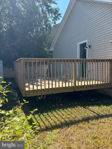 a view of balcony with wooden floor