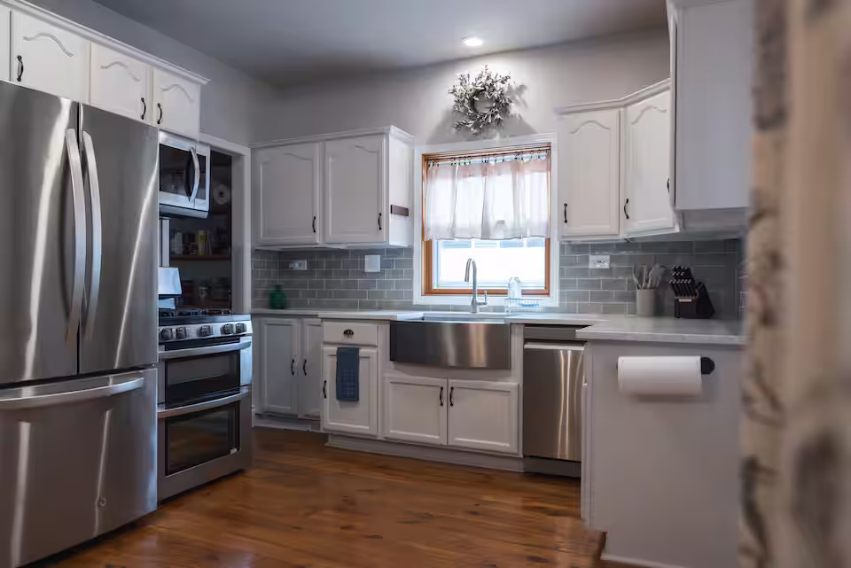 300 Division Street South Elgin, IL 60177 - Photo 11 of 23 a kitchen with granite countertop a refrigerator oven a sink and cabinets