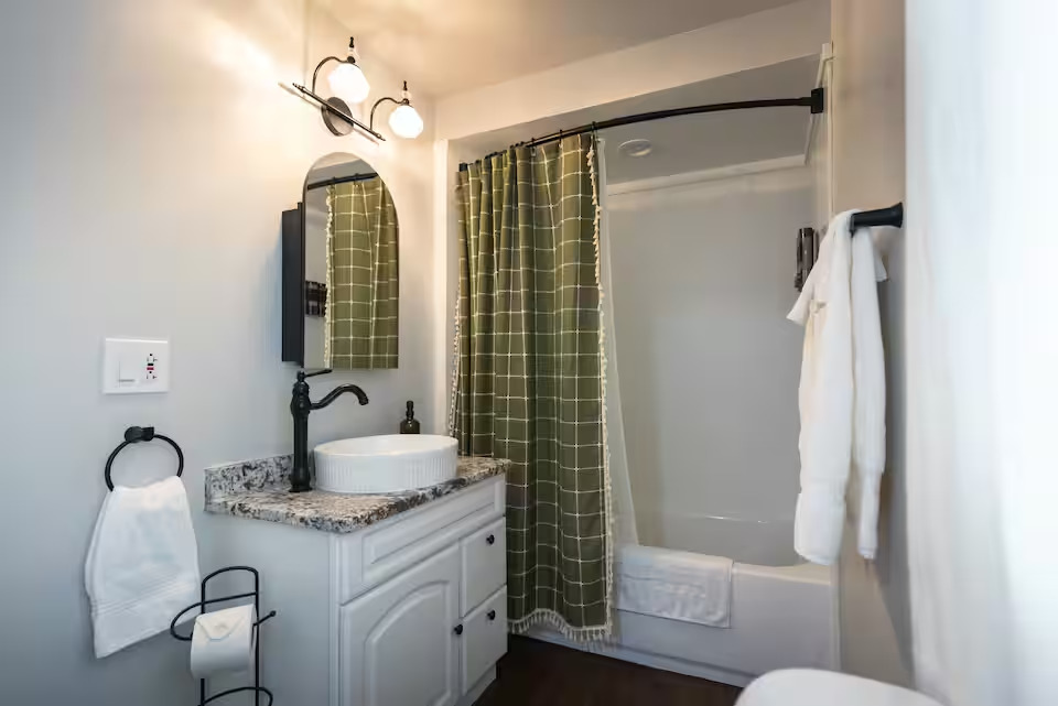 300 Division Street South Elgin, IL 60177 - Photo 12 of 23 a bathroom with a granite countertop sink a toilet and shower