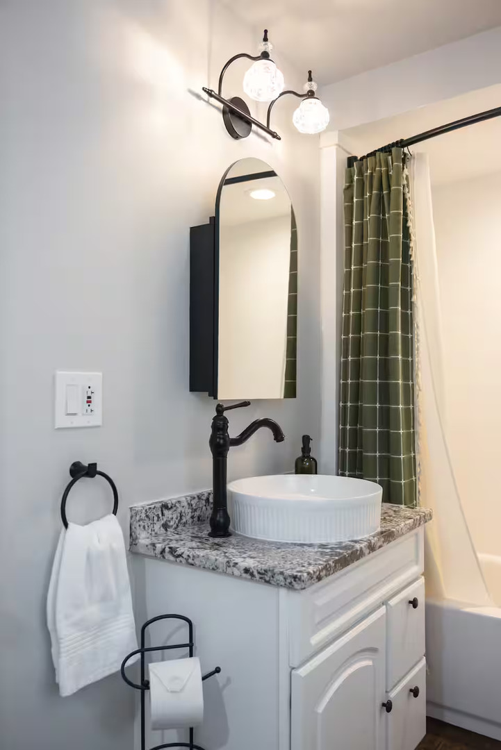 300 Division Street South Elgin, IL 60177 - Photo 13 of 23 a bathroom with a granite countertop sink and a mirror