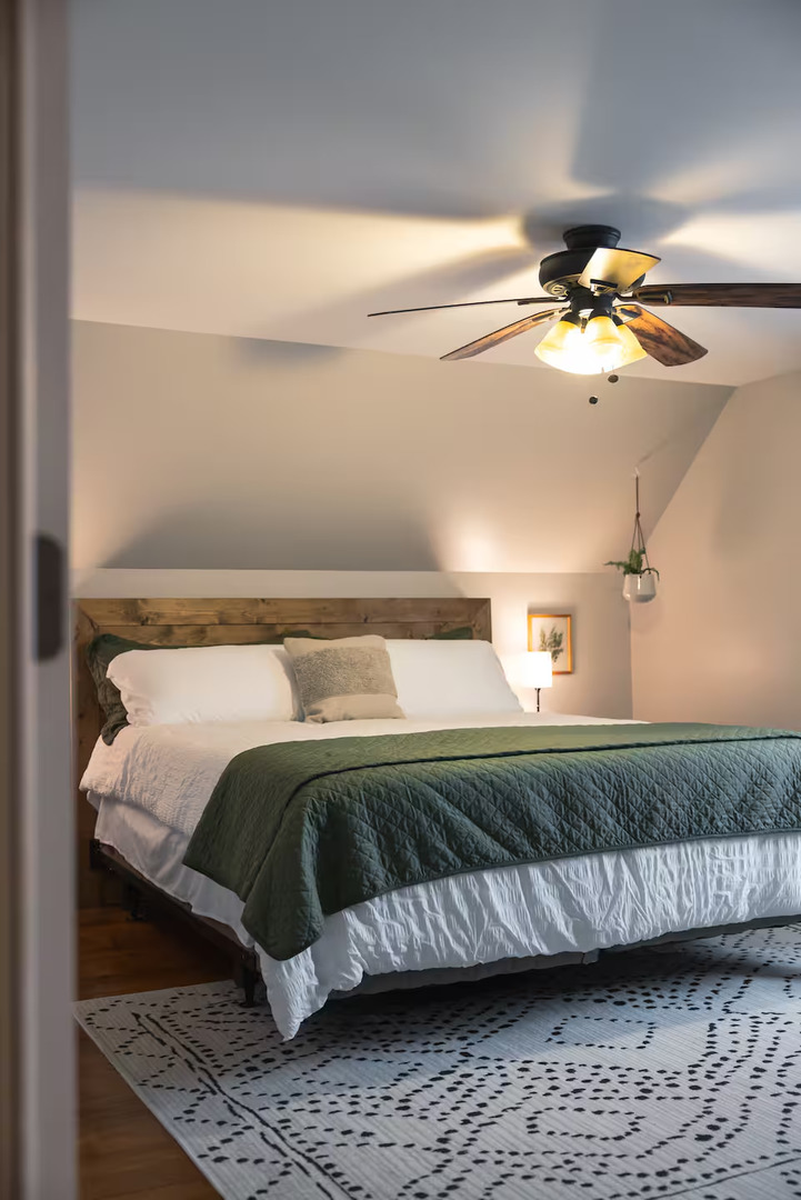 300 Division Street South Elgin, IL 60177 - Photo 17 of 23 a bedroom with a bed and a chandelier