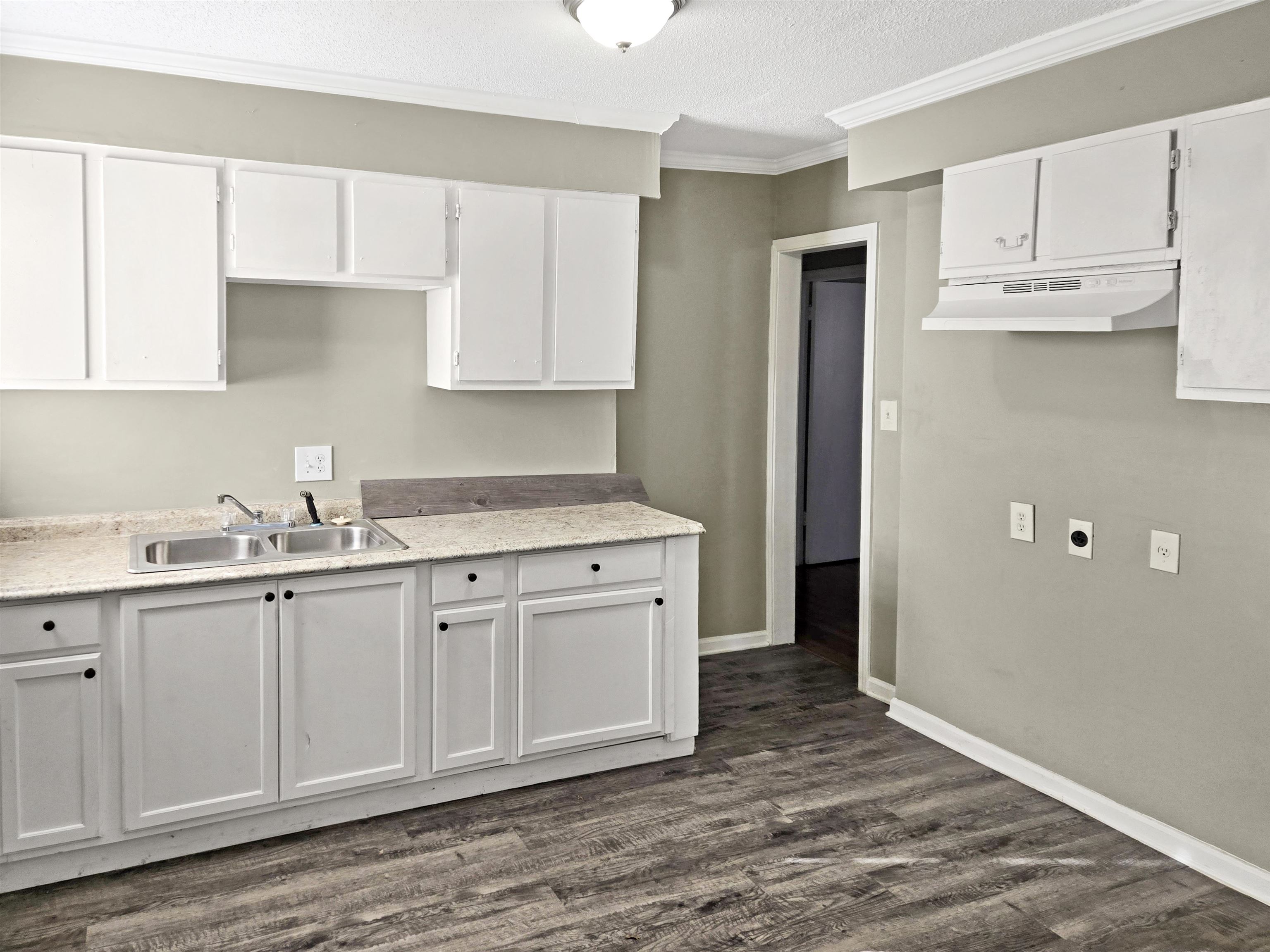 2667 Barron Avenue Memphis, TN 38114 - Photo 4 of 14 a kitchen with stainless steel appliances granite countertop a sink and cabinets