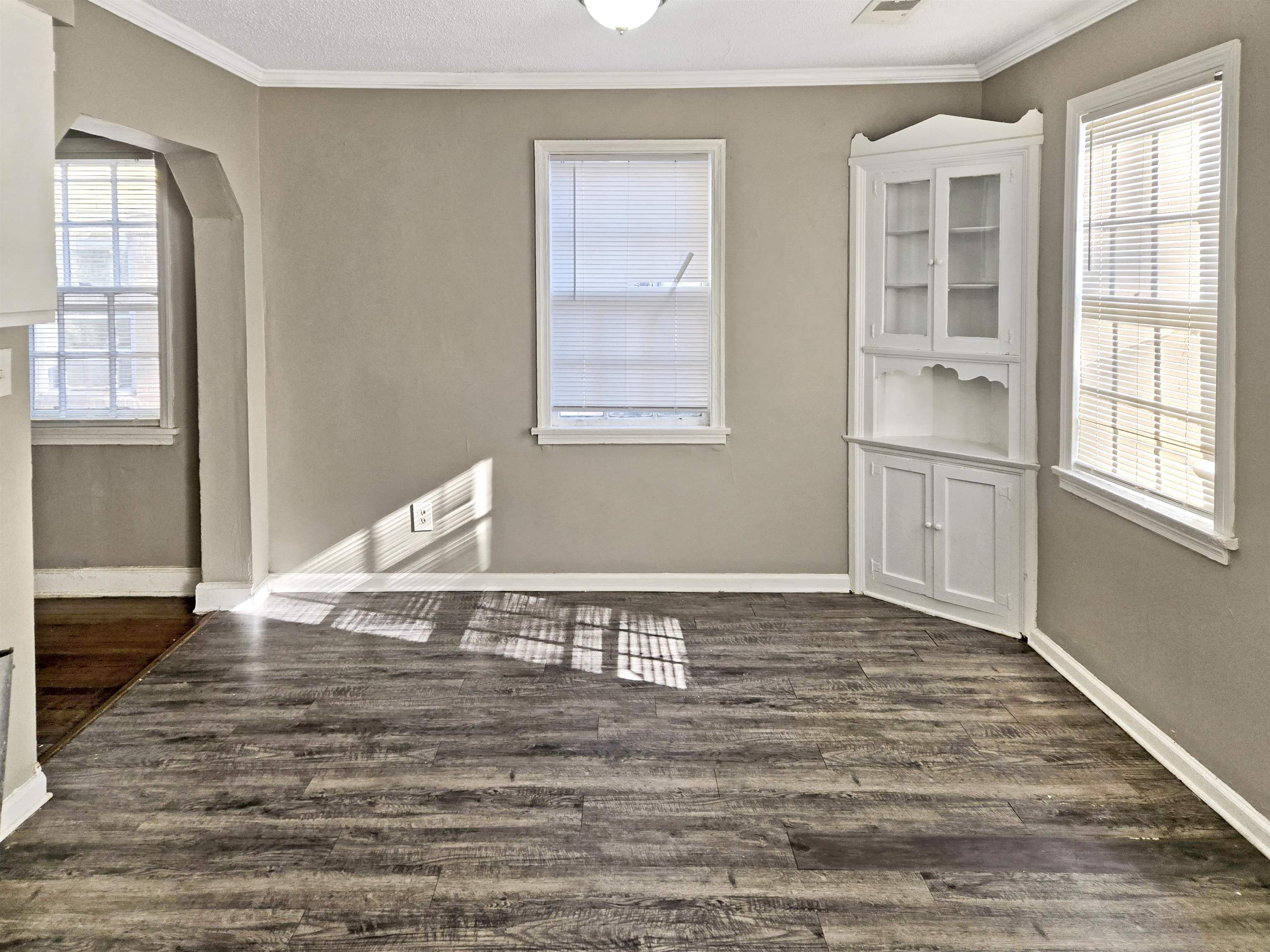 2667 Barron Avenue Memphis, TN 38114 - Photo 5 of 14 a view of an empty room with wooden floor and a window