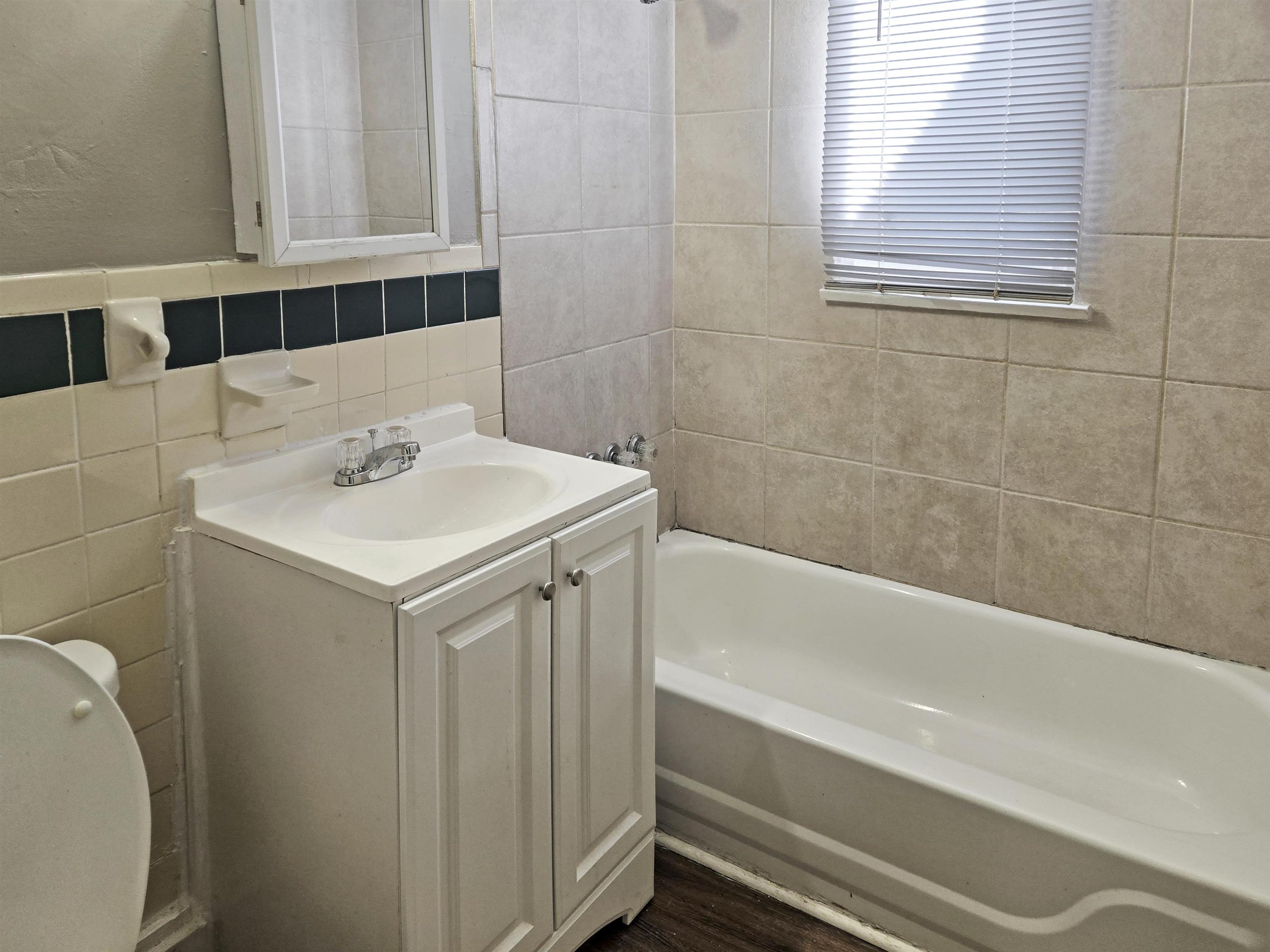 2667 Barron Avenue Memphis, TN 38114 - Photo 8 of 14 a bathroom with a sink a toilet and bathtub