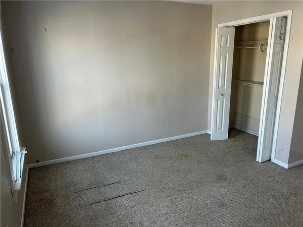 an empty room with closet