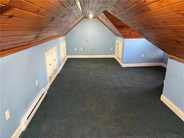 a view of a room with a ceiling fan