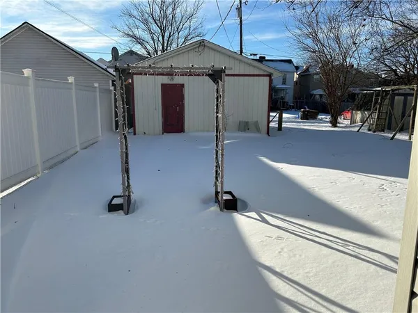 a view of a building with a snow on the road