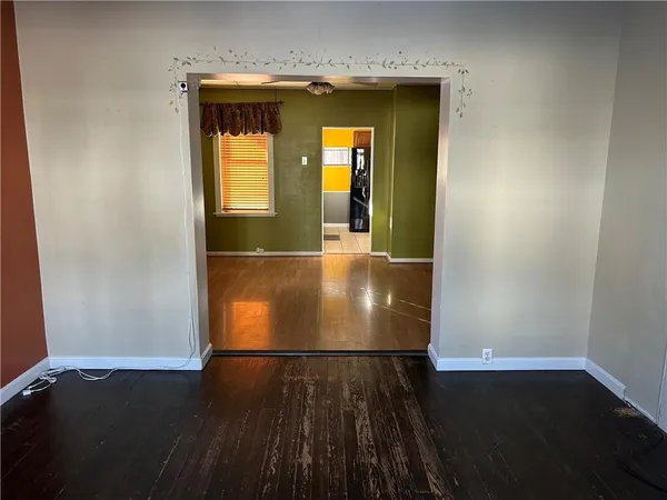 an entryway with wooden floor