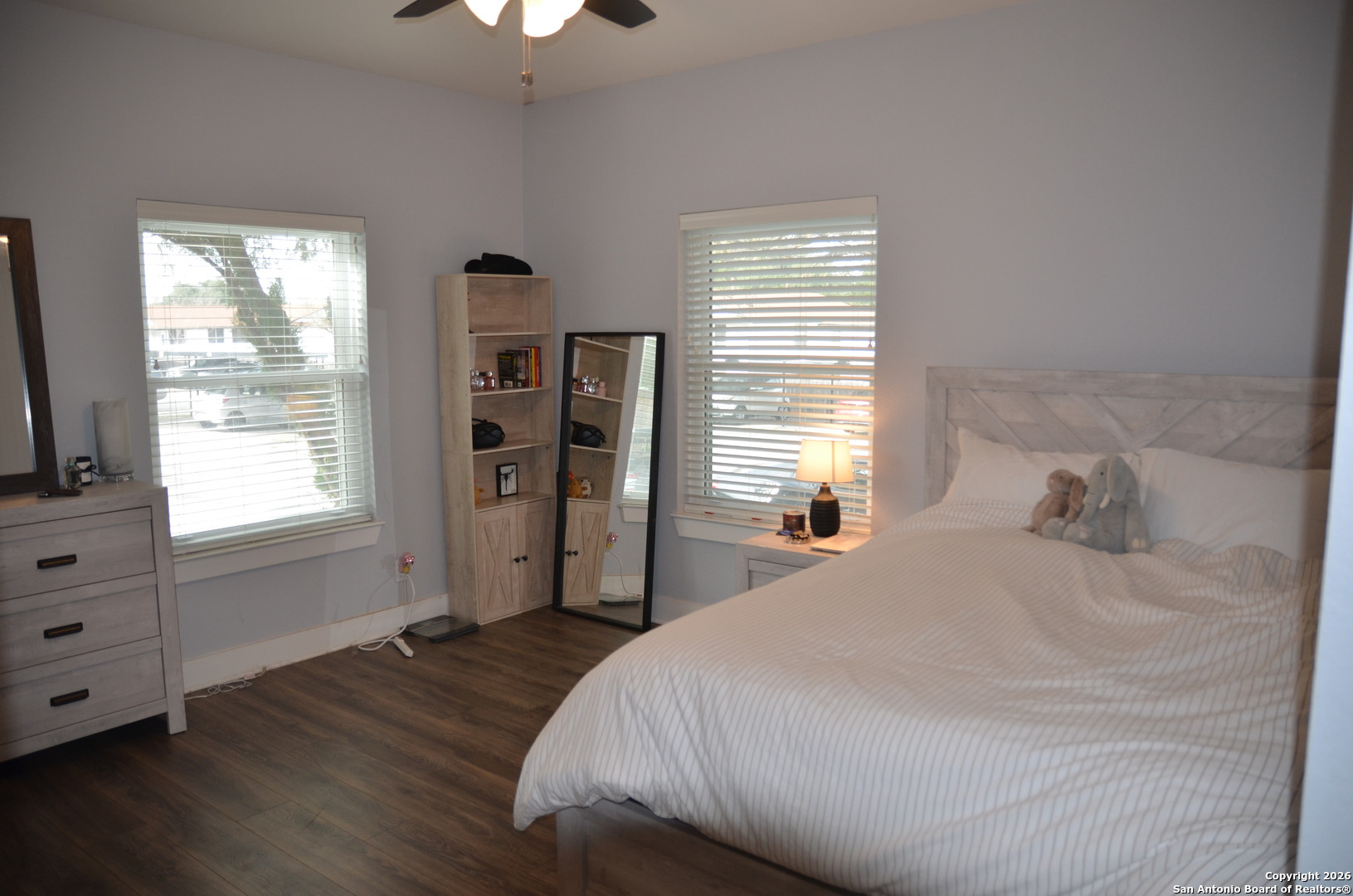 1819 Babcock Road, Unit 705G San Antonio, TX 78229 - Photo 12 of 22 a bedroom with a bed and a flat tv screen on the dresser