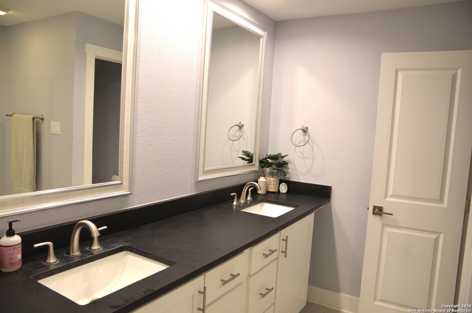 1819 Babcock Road, Unit 705G San Antonio, TX 78229 - Photo 15 of 22 a bathroom with a sink and a mirror