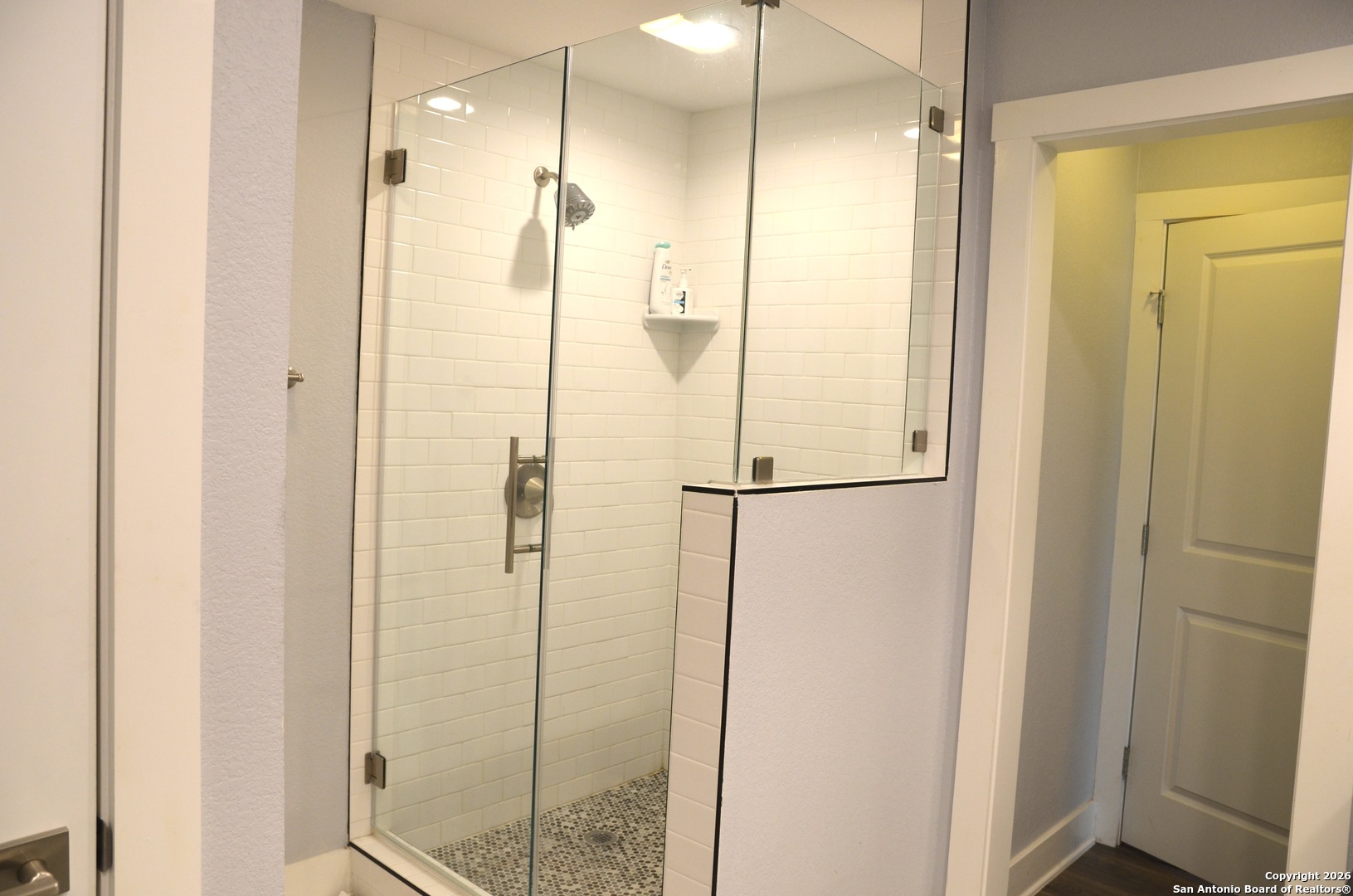 1819 Babcock Road, Unit 705G San Antonio, TX 78229 - Photo 18 of 22 a bathroom with a shower and a glass door