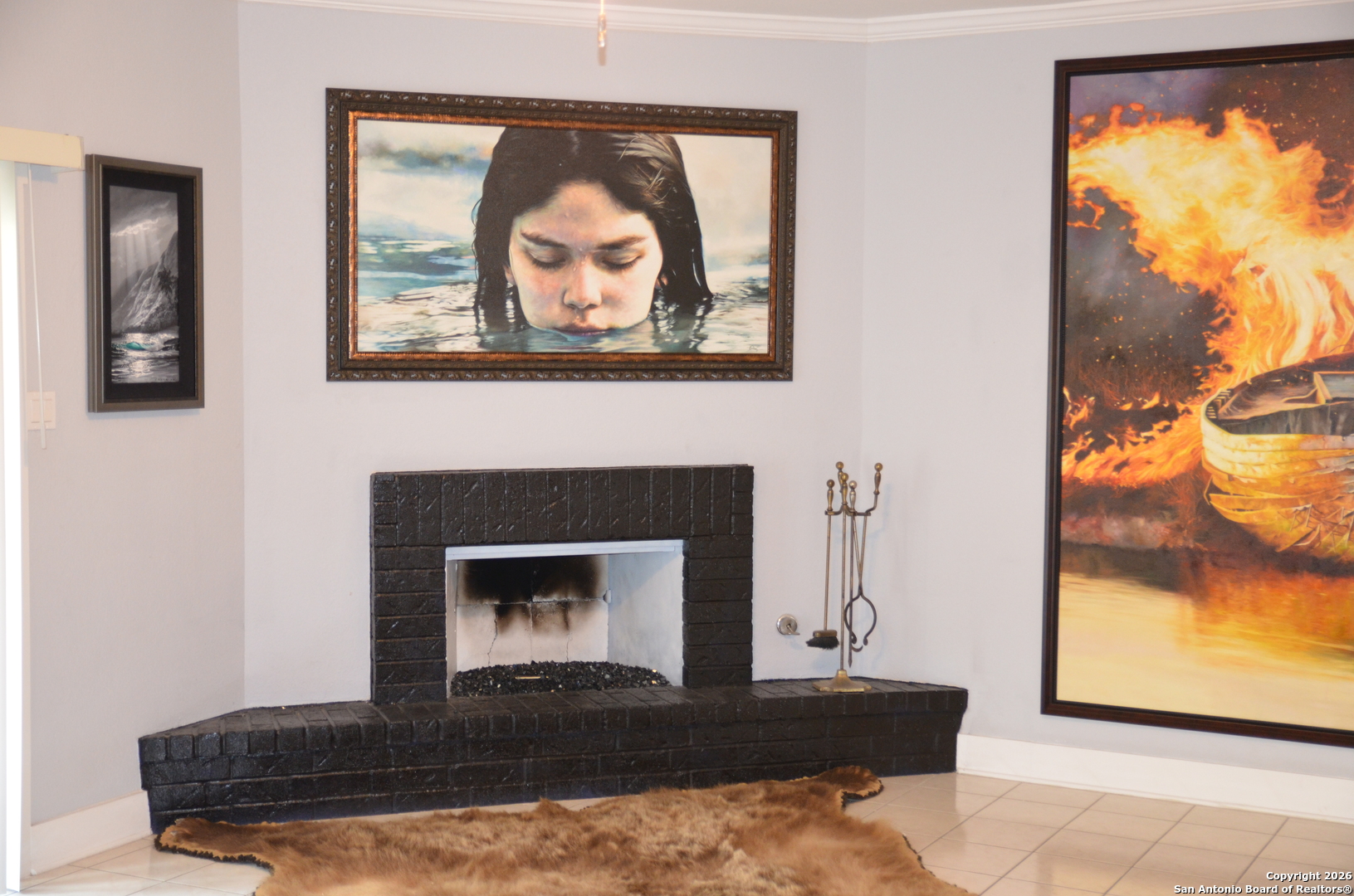 1819 Babcock Road, Unit 705G San Antonio, TX 78229 - Photo 20 of 22 a living room with a fireplace