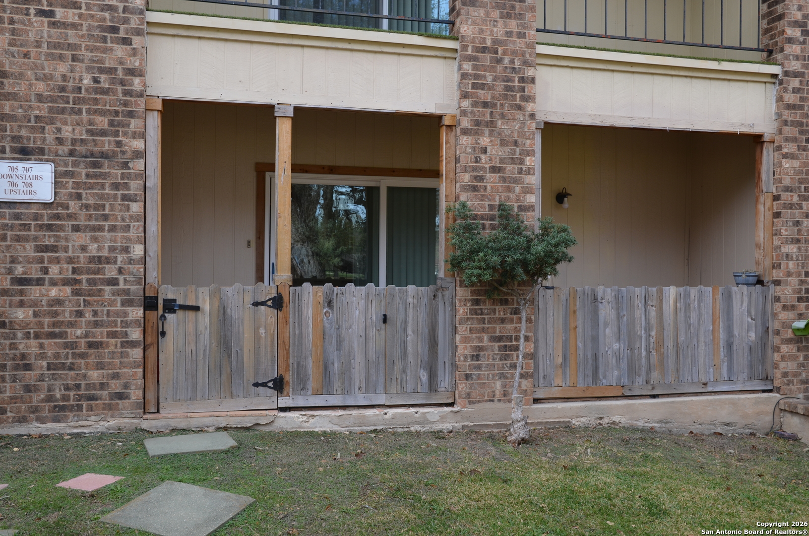 1819 Babcock Road, Unit 705G San Antonio, TX 78229 - Photo 6 of 22 a front view of a house with a garden