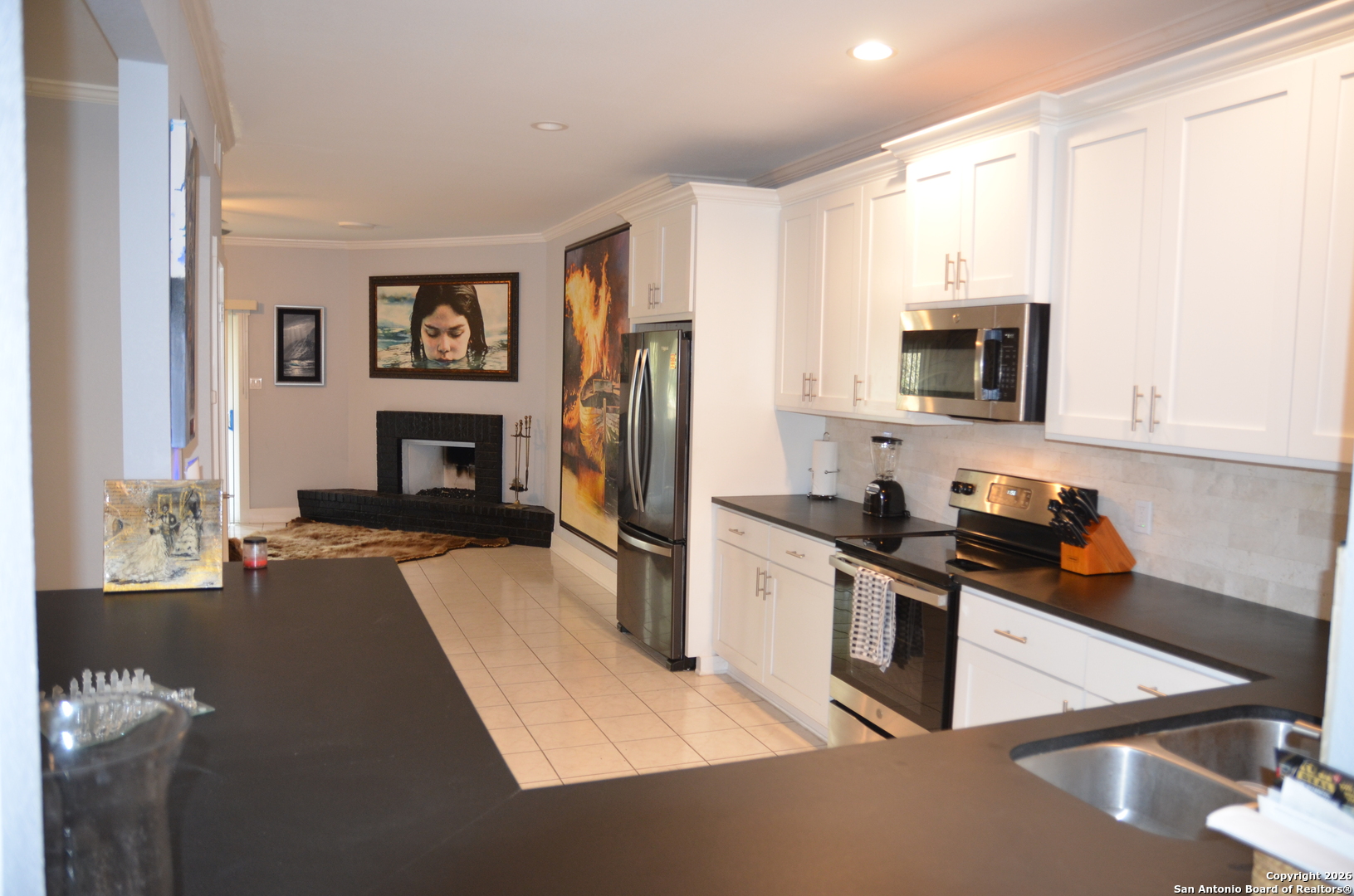 1819 Babcock Road, Unit 705G San Antonio, TX 78229 - Photo 9 of 22 a kitchen with stainless steel appliances a stove microwave and refrigerator