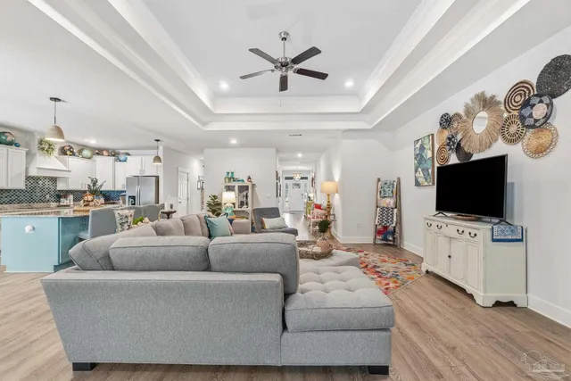 a kitchen with a dining table chairs refrigerator and cabinets