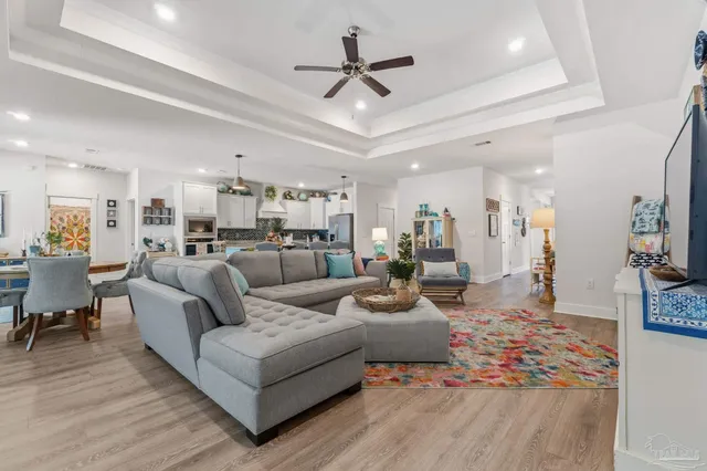 a kitchen with kitchen island a large counter top appliances and cabinets