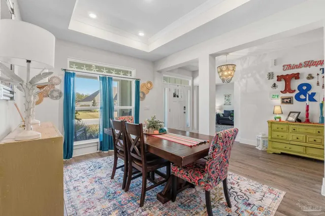 a bathroom with a granite countertop sink and a toilet