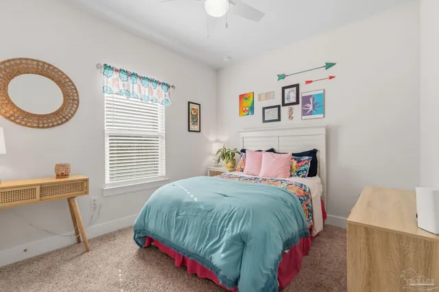 a spacious bathroom with a double vanity sink a mirror a vanity and a bathtub