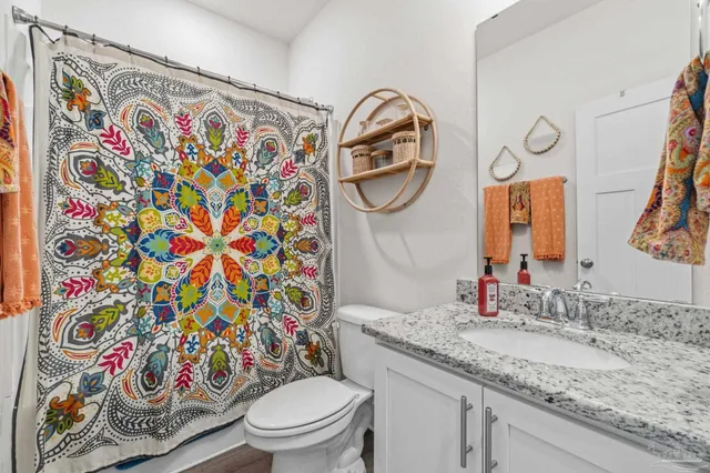a view of a patio with couches chairs and a potted plant