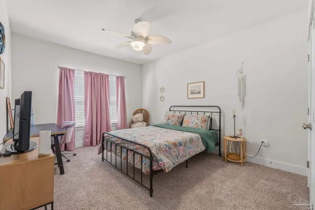 a view of a backyard with a garden and deck