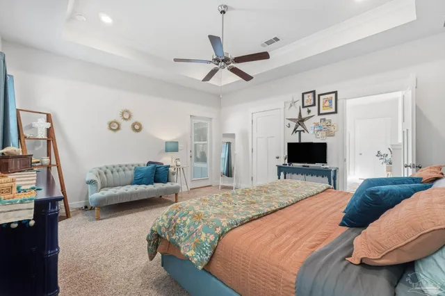 a aerial view of a house with a yard and potted plants