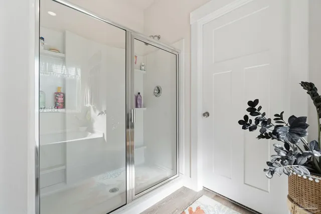 an aerial view of residential houses with outdoor space and swimming pool