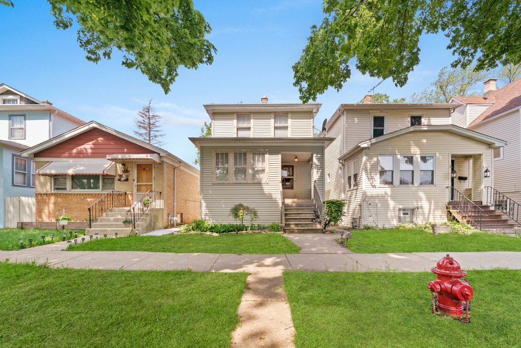 1224 Grove Avenue Berwyn, IL 60402 - Photo 1 of 23 a front view of a house with garden