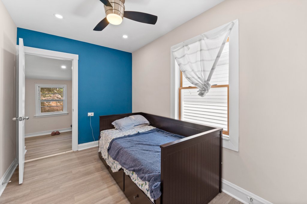 1224 Grove Avenue Berwyn, IL 60402 - Photo 15 of 23 a bedroom with a bed and a window