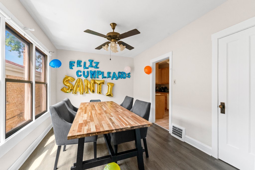 1224 Grove Avenue Berwyn, IL 60402 - Photo 8 of 23 a view of a dining room with furniture window and wooden floor
