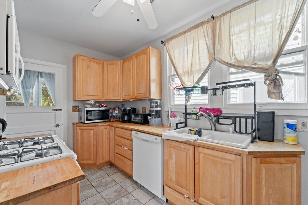 1224 Grove Avenue Berwyn, IL 60402 - Photo 10 of 23 a kitchen that has a sink and a stove