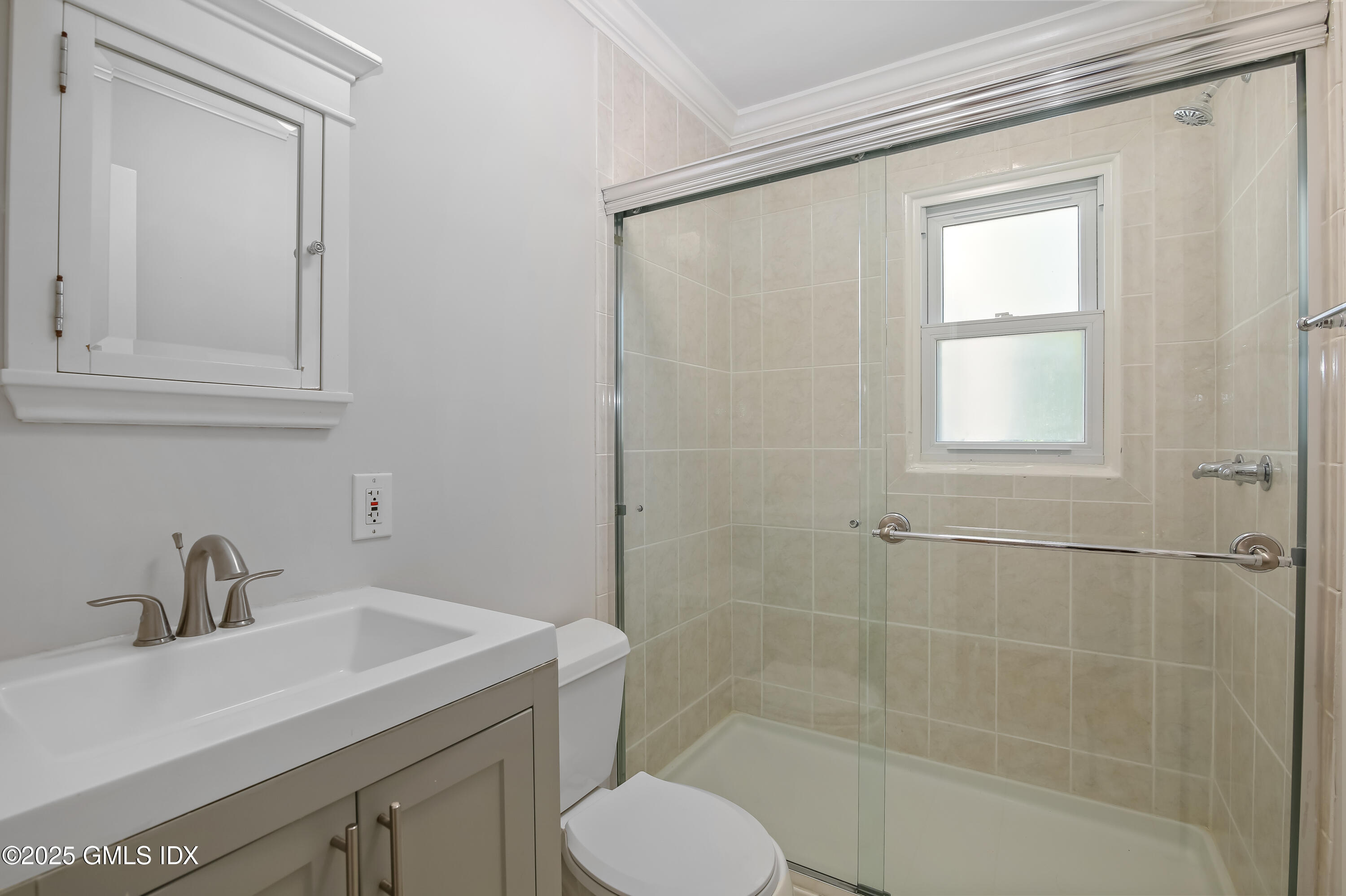 84 Indian Field Road Greenwich, CT 06830 - Photo 12 of 40 a bathroom with a sink toilet and shower