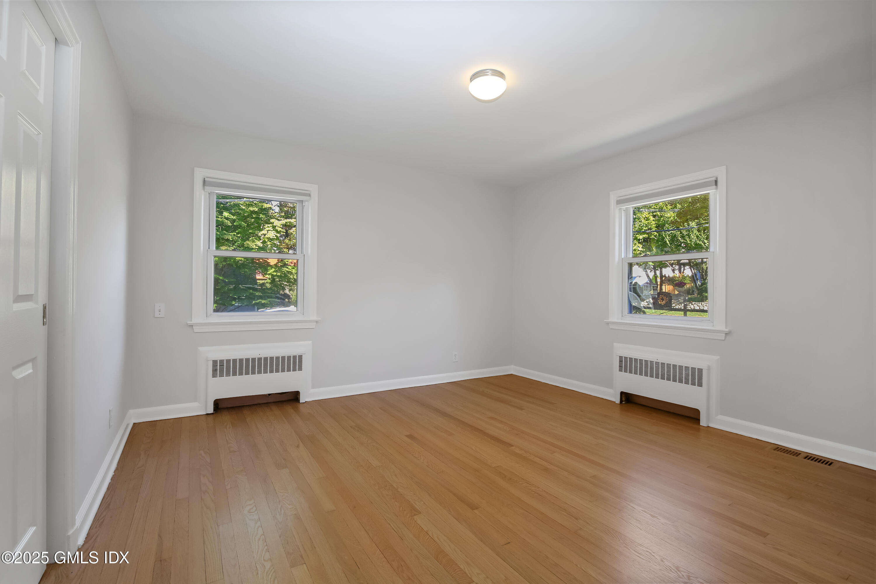 84 Indian Field Road Greenwich, CT 06830 - Photo 23 of 40 an empty room with windows