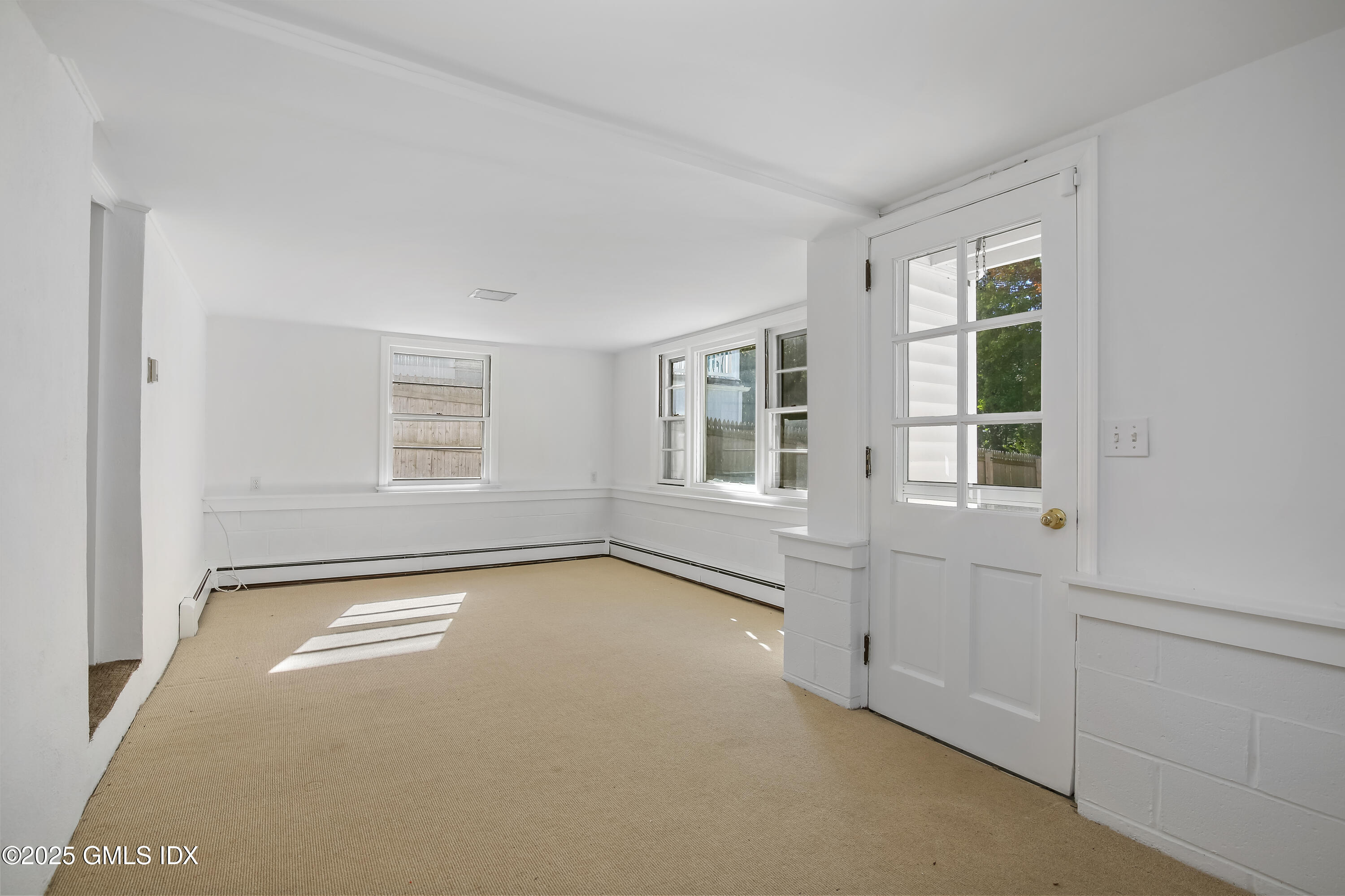 84 Indian Field Road Greenwich, CT 06830 - Photo 27 of 40 a view of an empty room with a window