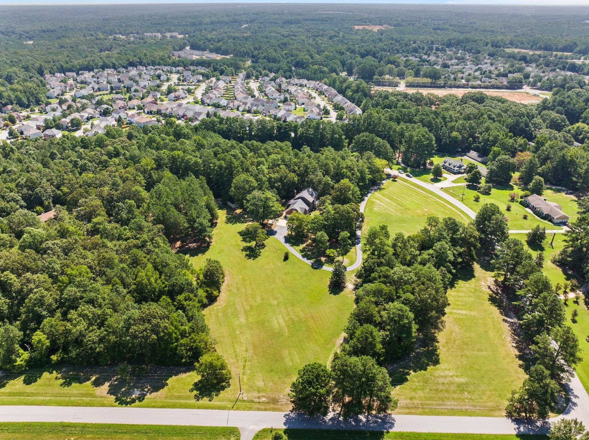 5101 Holly Ridge Farm Road Raleigh, NC 27616 - Photo 59 of 63 Hardwood trees surround private 9.47 acre lot, long driveway into your own oasis. Aerial View