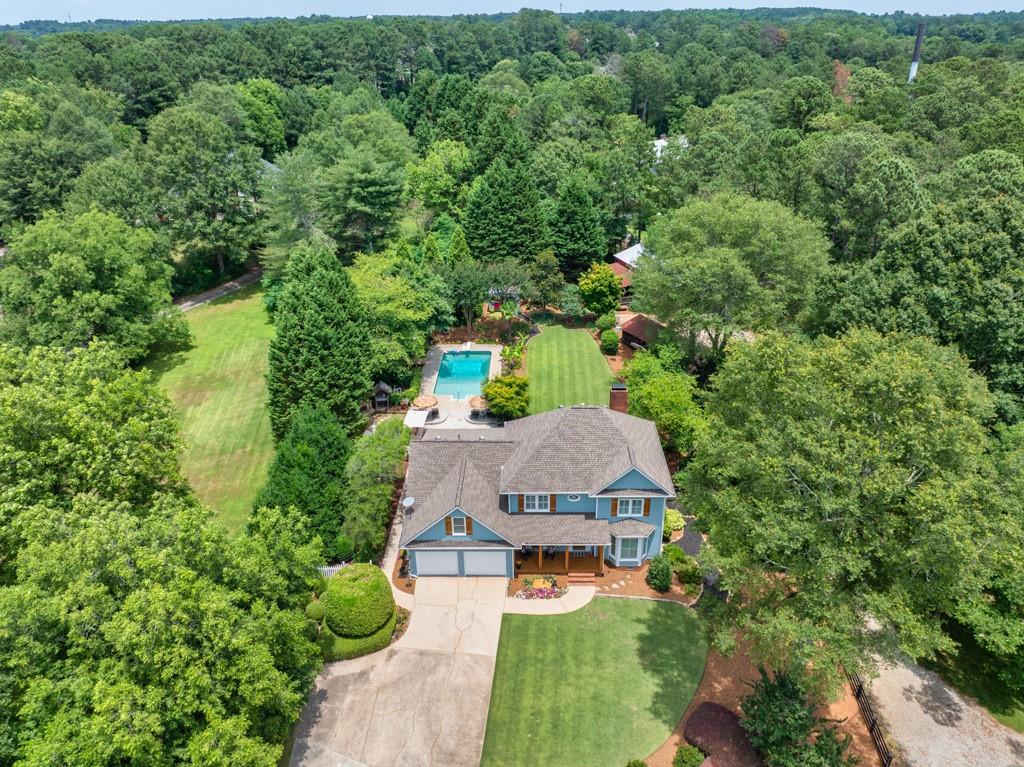 1698 Bennett Road Grayson, GA 30017 - Photo 1 of 1 an aerial view of a house with yard swimming pool and outdoor seating